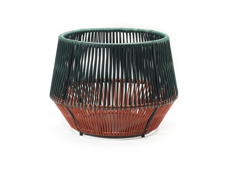 The Ames Caribe Chic Basket 2 features a modern round design with vertical woven threads—dark green on top, rust orange below—crafted from recycled plastic baskets, displayed against a white background.