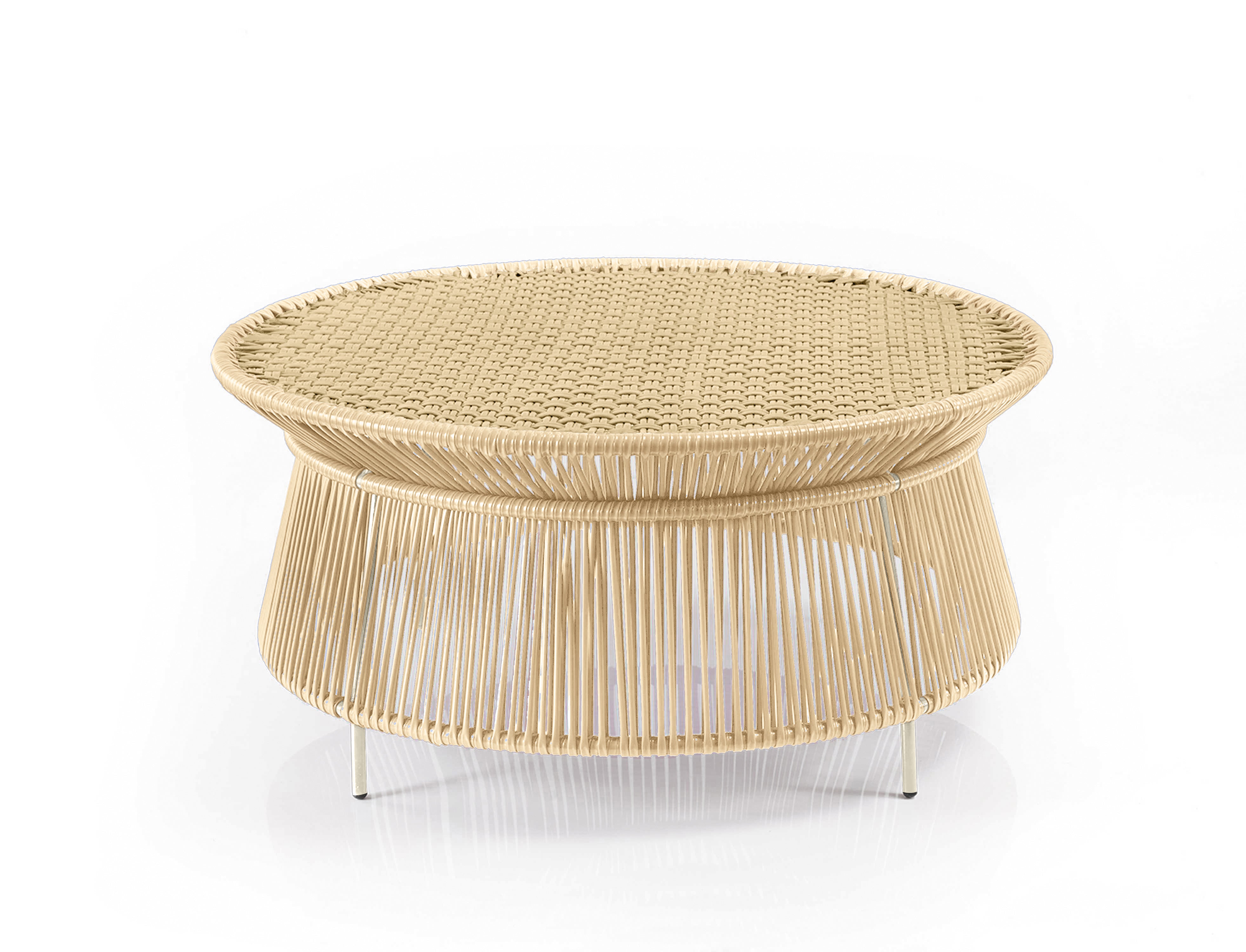 The Ames Caribe Chic Low Table by Ames is a round, woven rattan coffee table with a wide, flat top and open base, showcased against a plain white background.