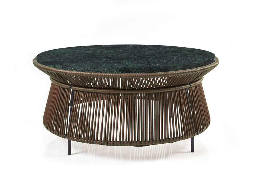 Inspired by Sebastian Herkner’s Caribe Chic series, the Ames Caribe Chic Low Table by Ames pairs a dark green marble top with a base of brown woven cords and sleek metal legs—ideal for those seeking a distinctive marble accent piece.