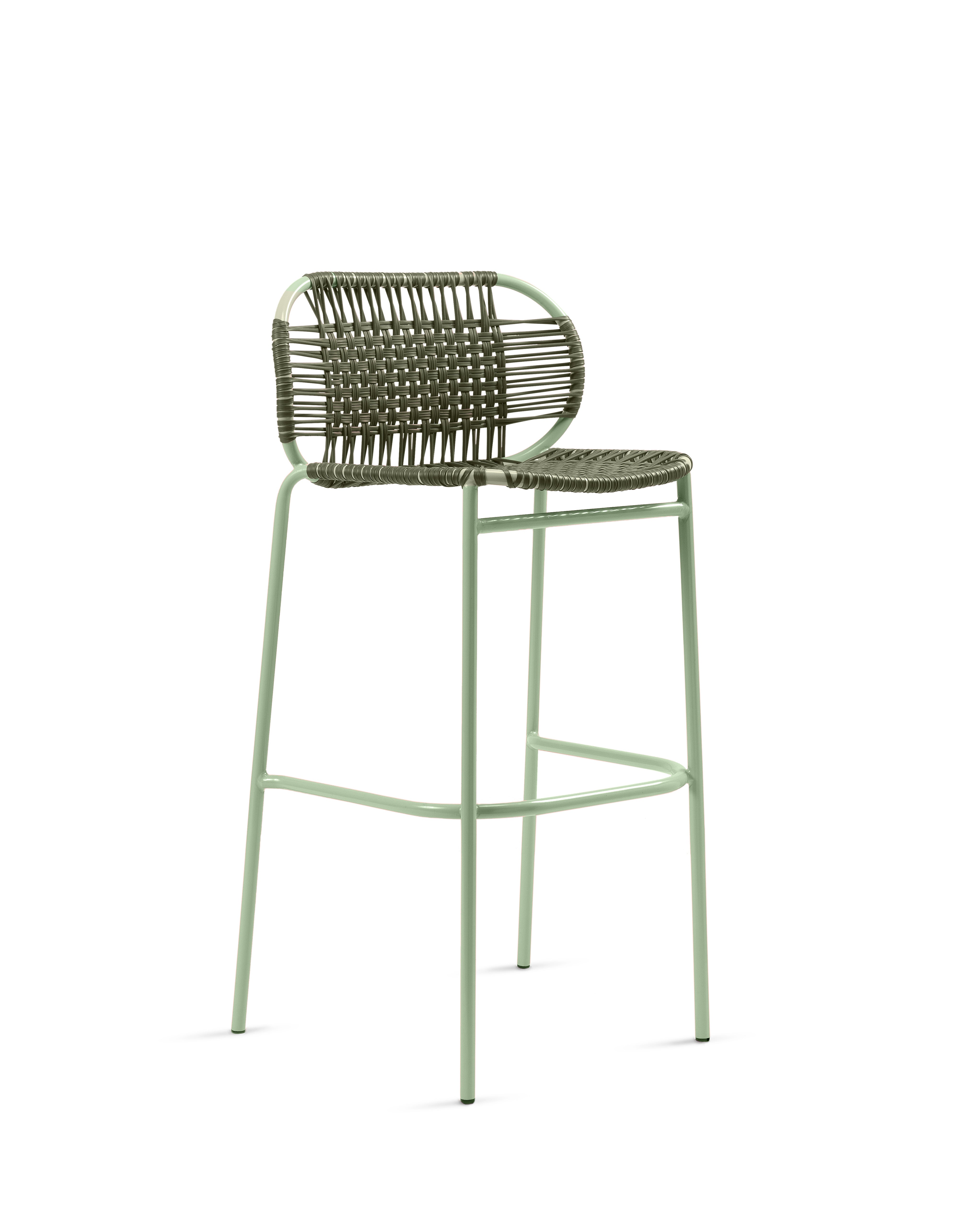 The Ames Cielo Barstool by Ames features a sage green metal frame, woven backrest, and matching seat. Its open, modern design and footrest bar make it a stylish, comfortable seating option inspired by the original Cielo Bar Stool.