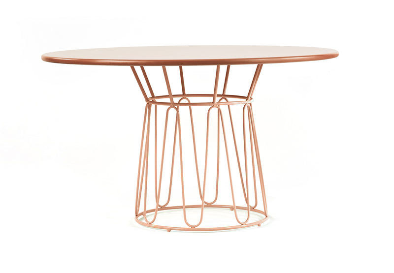 The Ames Circo Dining Table by Ames features a smooth brown round top and a modern metal base with geometric copper wire loops and braided leather cords, making it perfect for indoor use against a white background.