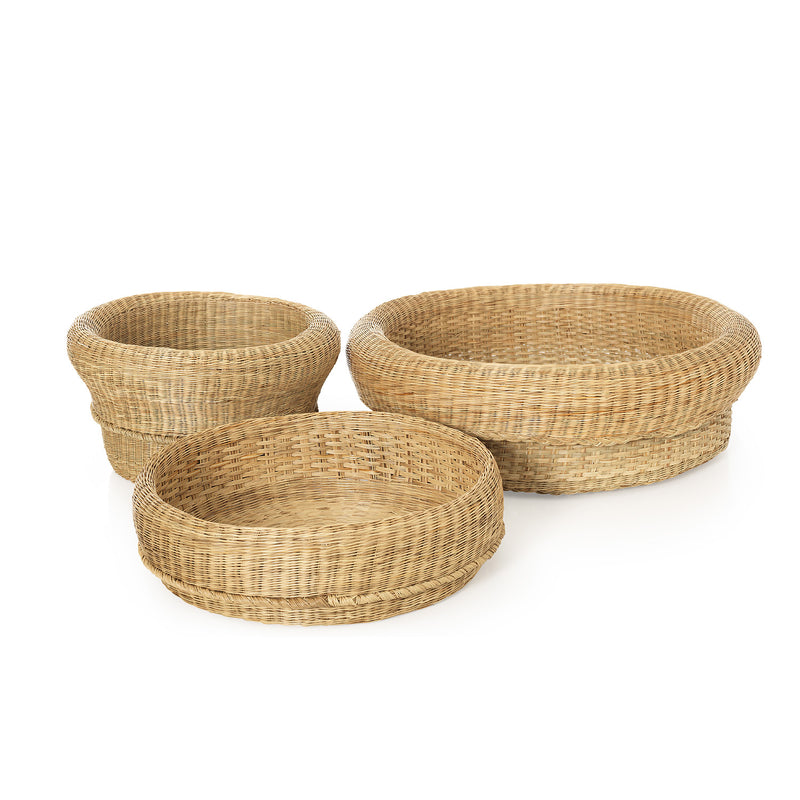 The Ames Fibra Basket Large by Ames, handcrafted in Colombia from esparto grass, features three round woven baskets displayed together on a white background.