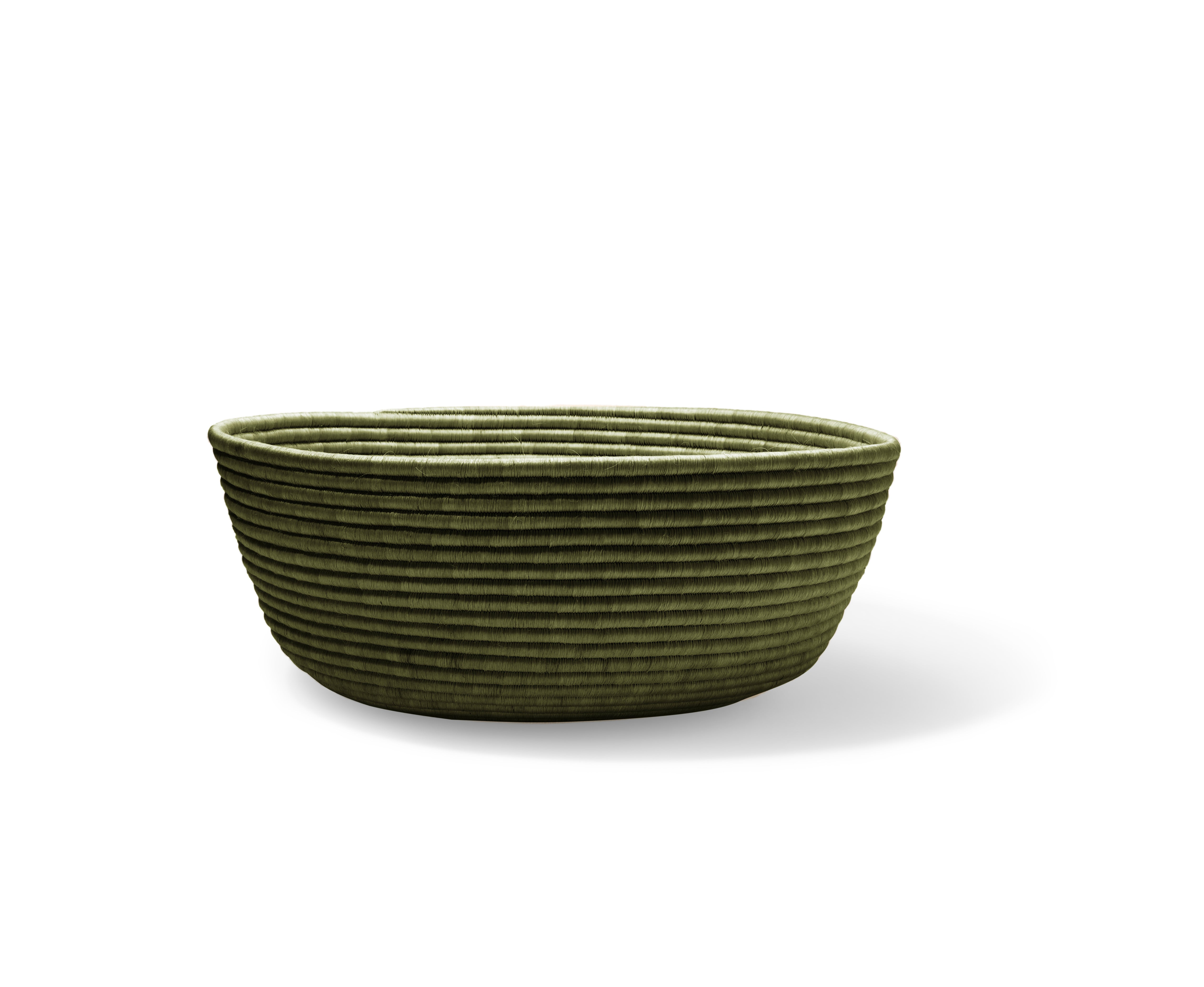 The Ames La Che Baskets by Ames are green, oval-shaped bowls with a ribbed texture and gently sloped sides, inspired by handmade baskets. Evenly spaced horizontal ridges decorate the surface. Shown on a white background.