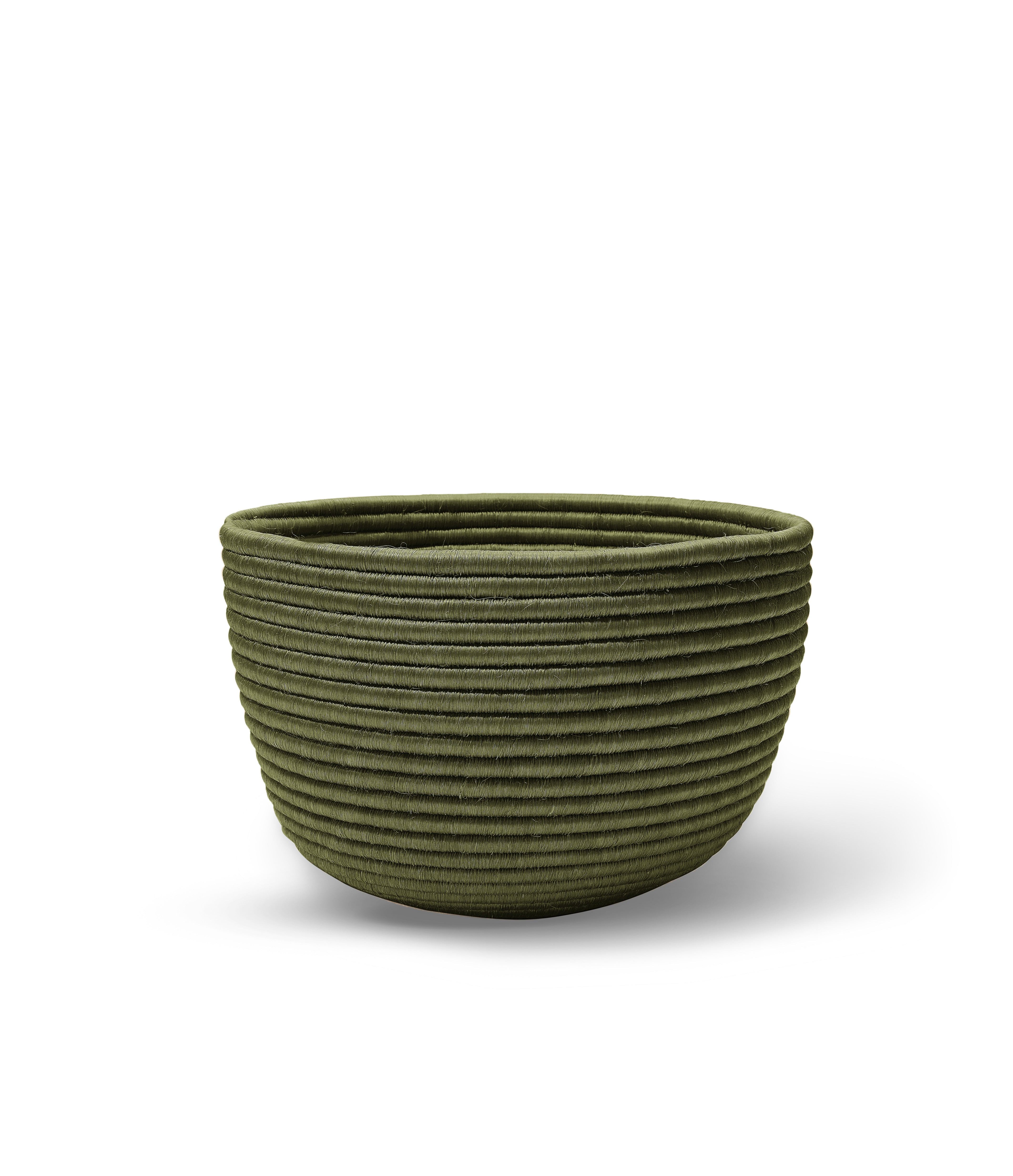 The Ames La Che Basket by Ames is a green, round bowl with a ribbed, textured surface made from Fique fibers, shown on a white background.