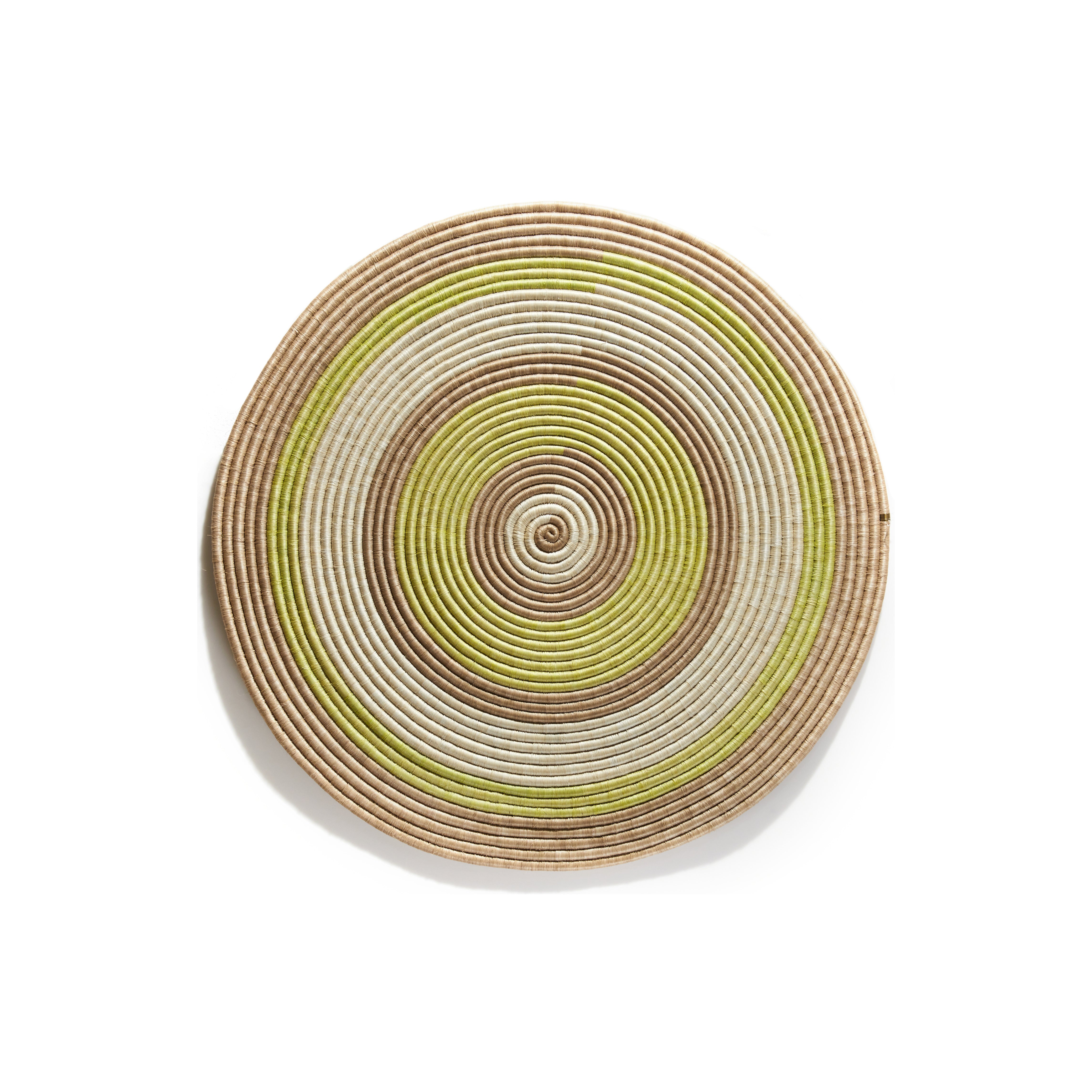 The Ames Ojitos Wall Decoration Andes by Ames is a round, woven basket made from fique palm fibers, featuring beige, brown, and light green concentric circles—perfect for adding unique style to your wall decor.