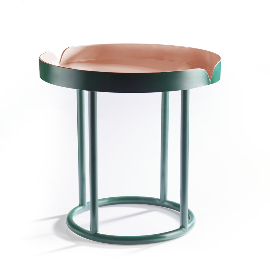 The Ames Victorias Coffee Table 3 by Ames features a modern round design with a pink raised curved-edge top and teal metal frame. Its minimalist Amazonia-inspired style makes it the perfect accent piece for any space.