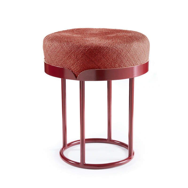 The Ames Victorias Pouf by Ames features a round, textured fabric seat in reddish-brown and a matching red metal frame, inspired by Amazonia furniture, with four vertical legs and a circular base.