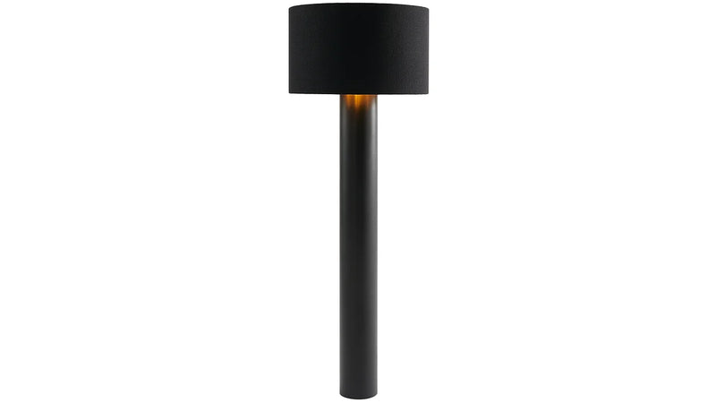 The ALL ROUND Floor Lamp by Victor Foxtrot is a sleek black, minimalist piece with a wool fabric cylindrical base and matching shade. It provides a warm, elegant glow that enhances any space with subtlety.