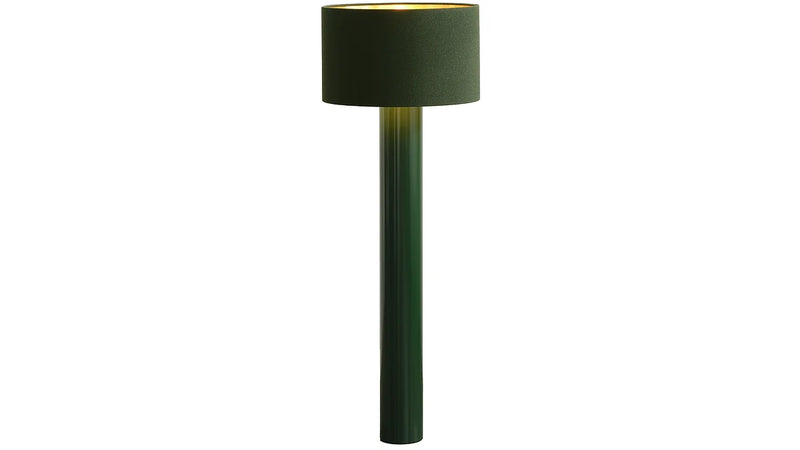 The Victor Foxtrot ALL ROUND Floor Lamp features a tall, cylindrical design with a modern touch. It has a round base and green wool fabric lampshade. The lamp emits a soft, warm light from the top when lit.