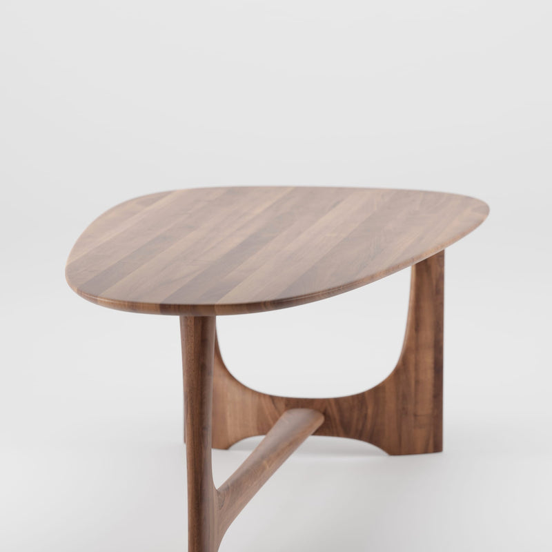 Wooden side table with a minimalist design on a white background