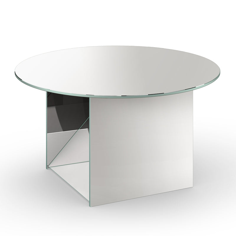 The CT11 Kaisa by E15 is a modern, round glass table designed by Annabelle Klute. It offers sculptural elegance with a sleek surface, geometric mirrored base, and minimalist design against a plain white background.