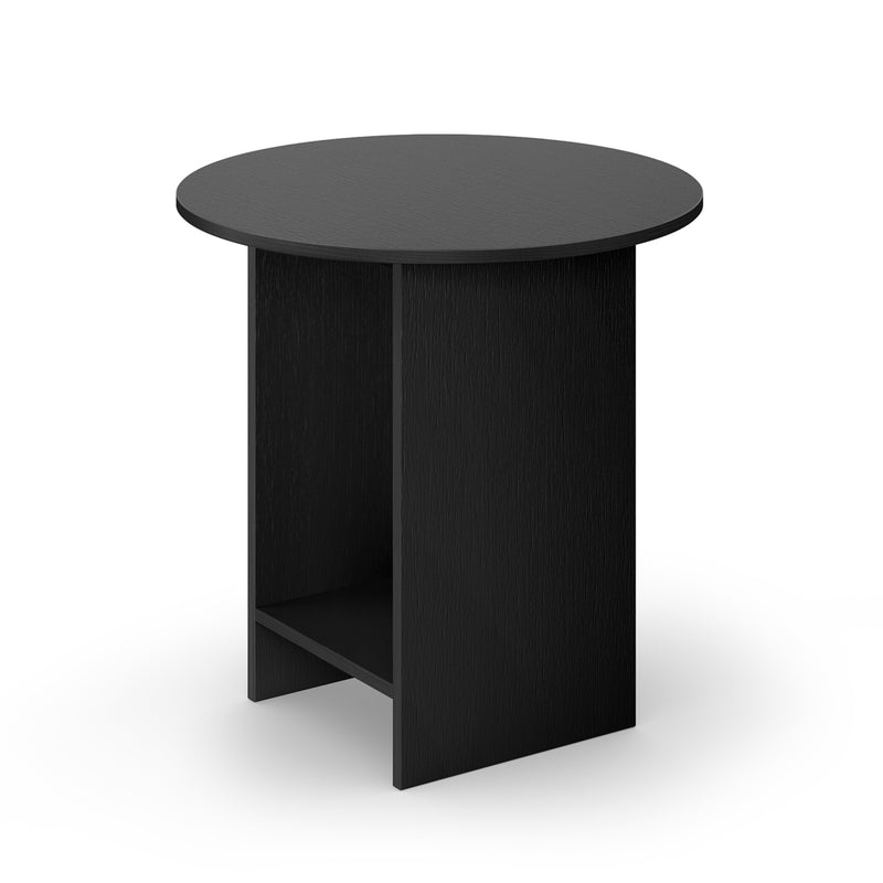 The CT12 Heiji by E15 is a minimalist black round side table made from lacquered plywood, featuring a flat top and unique angled base with a small shelf underneath. Its design reflects Japanese aesthetics, elegantly set against a white background.