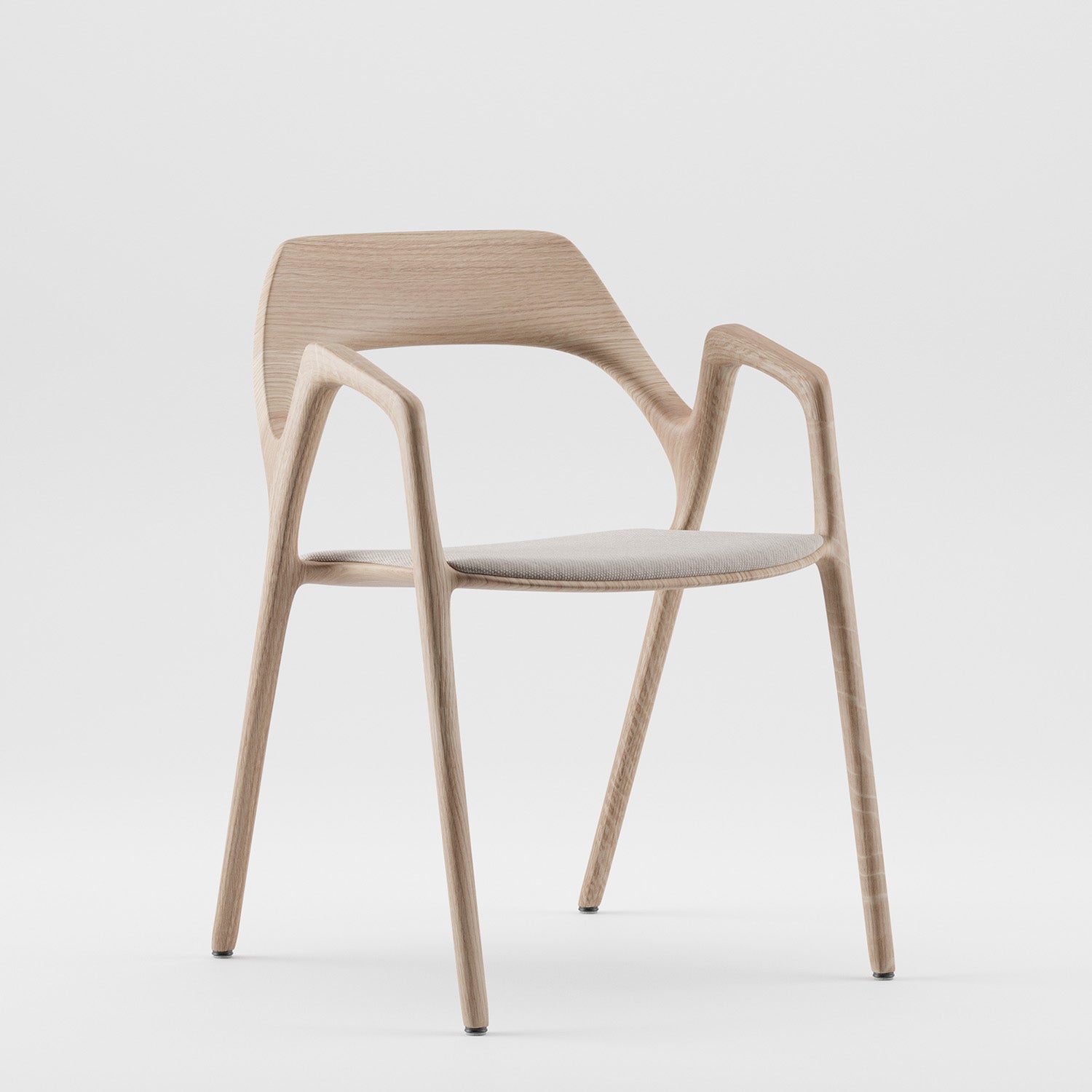The Ging Chair by Artisan is a modern piece with a sleek, minimalist design made from eco-friendly materials. It has smooth curved lines, a light beige cushioned seat, an open backrest, and thin angled legs, all in a light wood finish.