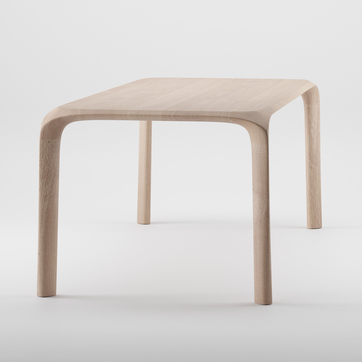 The Artisan Ging Table is a minimalist design crafted from solid wood, featuring smoothly curved legs and a square top. Its light wood finish highlights the organic beauty of wood, offering a sleek modern look with gentle curves on corners and legs.