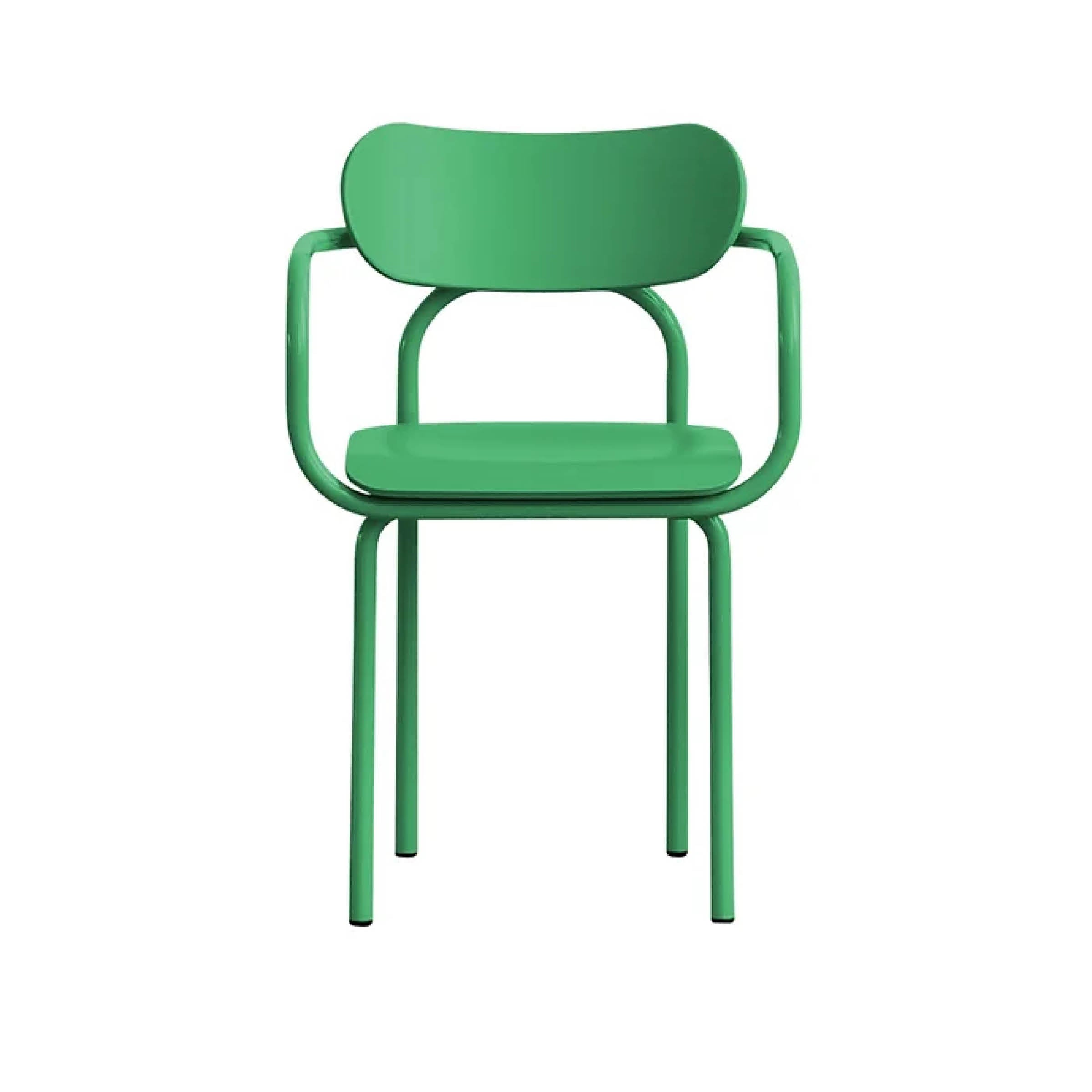 The Double U Armchair by Victor Foxtrot is a green metal chair featuring a minimalist design. It has a rounded backrest, armrests, and four tubular steel legs, all set against a plain white background.