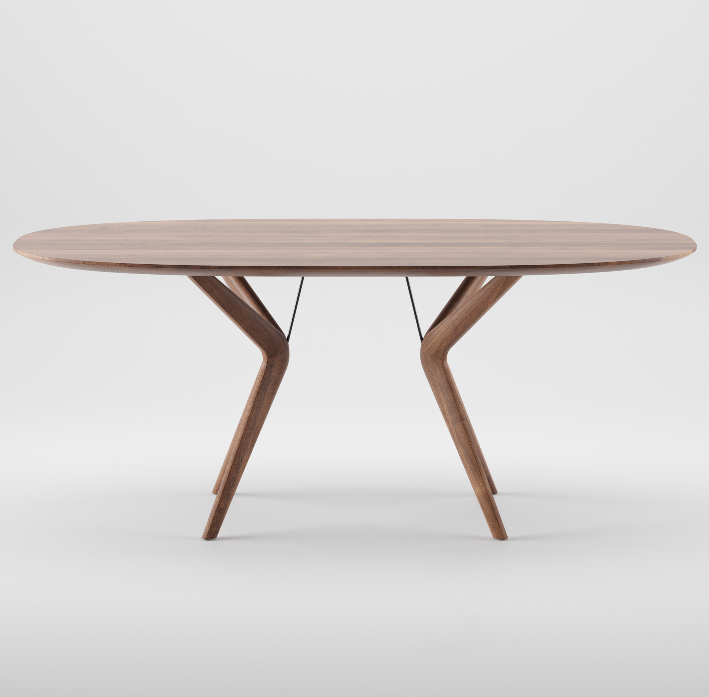 The Artisan LAKRI Oval Table features a smooth, oval top with two uniquely angled, V-shaped legs made from solid wood. Its modern, minimalist design exudes elegance through its luxurious wood texture, beautifully showcased against a plain white background.