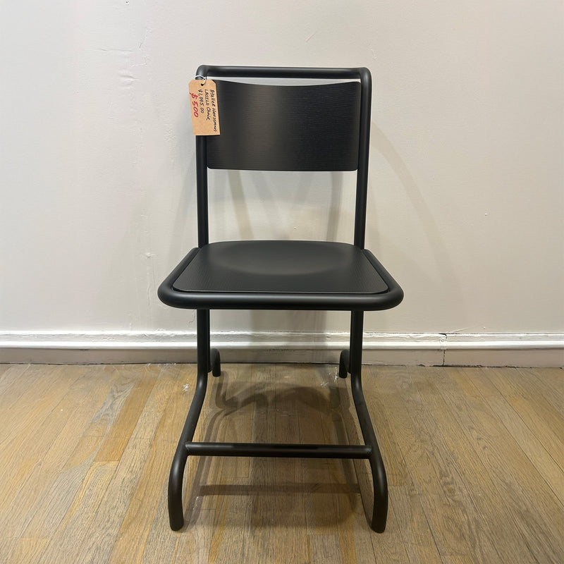 László Chair in black steel tube frame with plywood seat and cantilever design, perfect for comfortable seating.