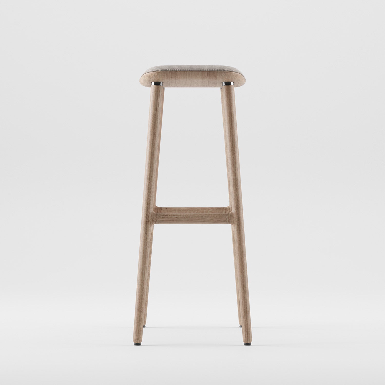 The NARU Barstool by Artisan is a minimalist masterpiece made from solid wood, featuring a smooth flat seat and slender legs. Its sleek design, set against a white background, showcases the luxurious wood texture and contemporary style.