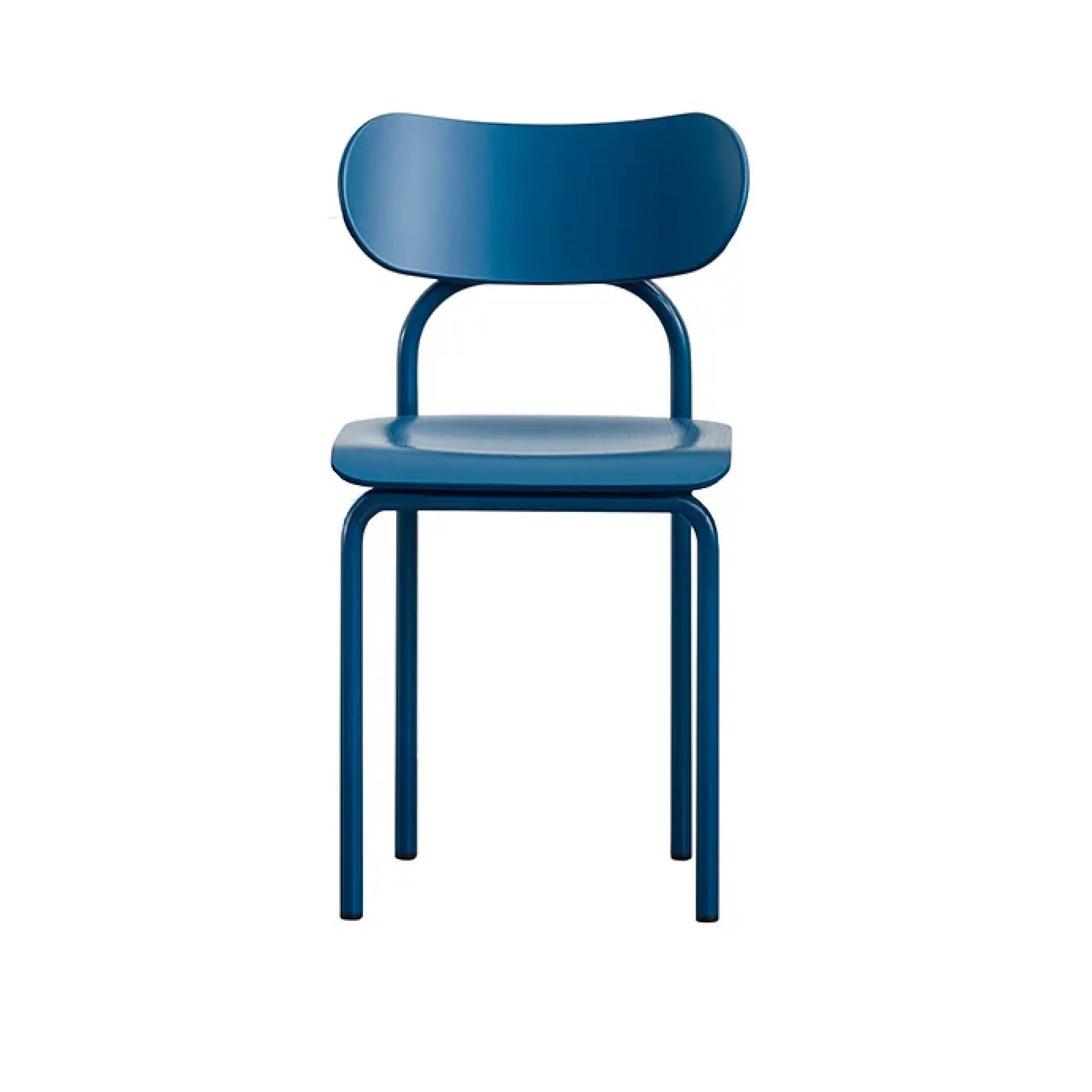 The Double U Chair by Victor Foxtrot is a modern blue chair with a rounded backrest and seat, featuring iconic aesthetics and minimalist design. It rests on four elegant tubular steel legs against a plain white background.