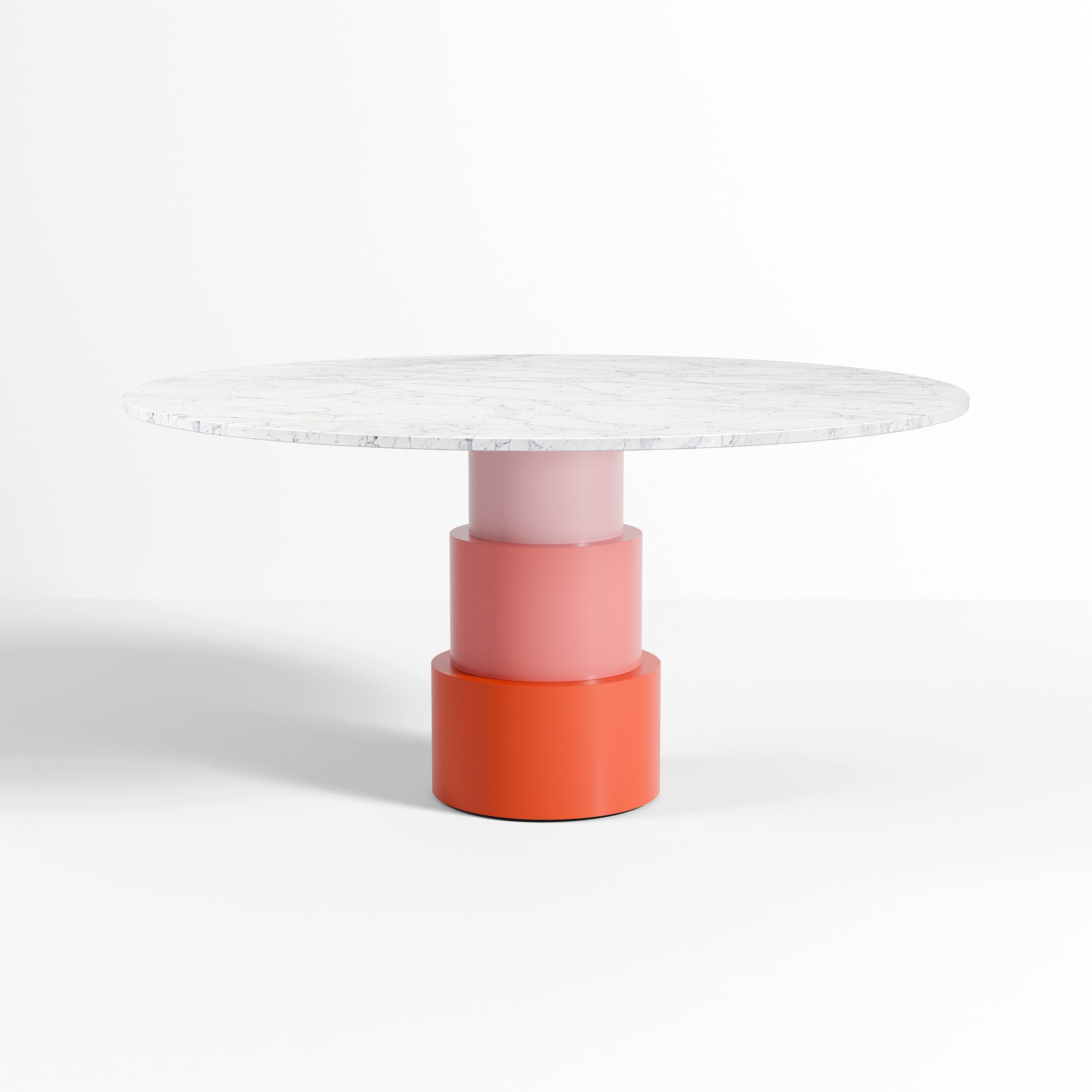 U Turn Table Carrara Marble with a slim marble top and colorful three-tiered cylindrical base in shades of pink and orange.