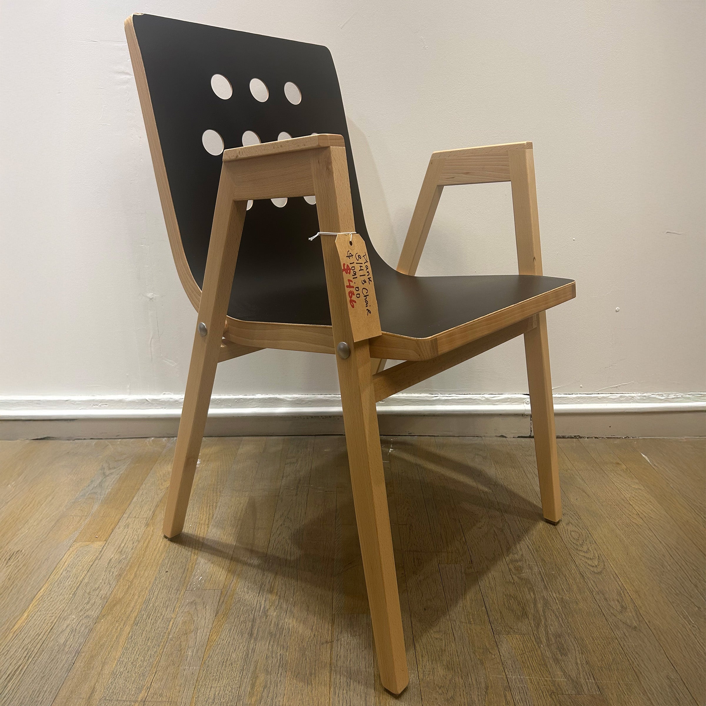 3/4/3 Armchair - Sale, black beech plywood seat with holes, solid beech frame, modern stackable design by Roland Rainer.