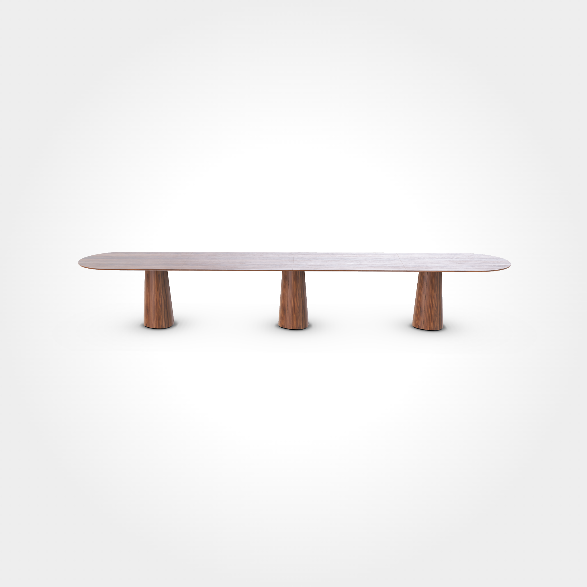 The P.O.V. Plus Table 480 by TON is a long, oval-shaped wooden dining table featuring a smooth surface and three cylindrical pedestal legs, elegantly standing against a plain white background.