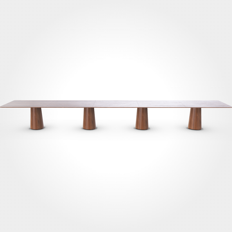 The P.O.V. Plus Table 481 by TON is a long, rectangular wooden office and dining table with a polished surface. Supported by five evenly spaced cylindrical wooden legs, its minimalist design is emphasized against a plain white background, making it ideal for contract and hospitality settings.