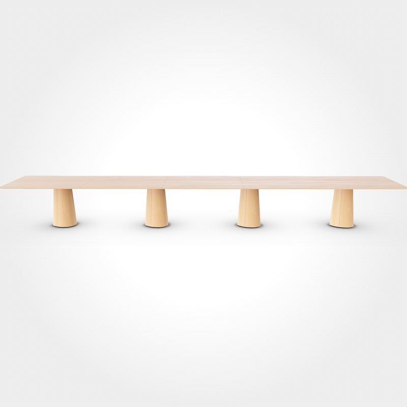 The P.O.V. Plus Table 481 by TON is a long, minimalist wooden dining table featuring a rectangular top with a light finish, supported by four evenly spaced cylindrical wooden legs, shown against a plain white background. Its versatile enough to function as both an office and dining table.