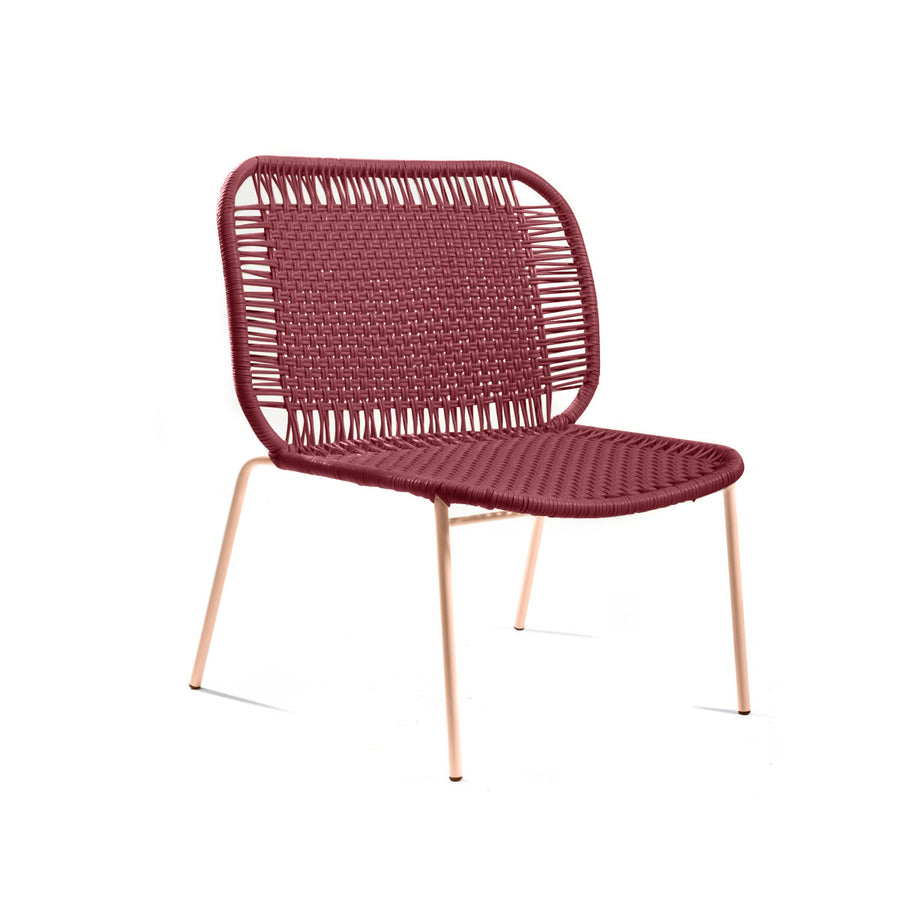 The Ames Cielo Lounge Chair Low by Ames features a woven burgundy seat and backrest with four slim, light metal legs—ideal for both indoor and outdoor settings.