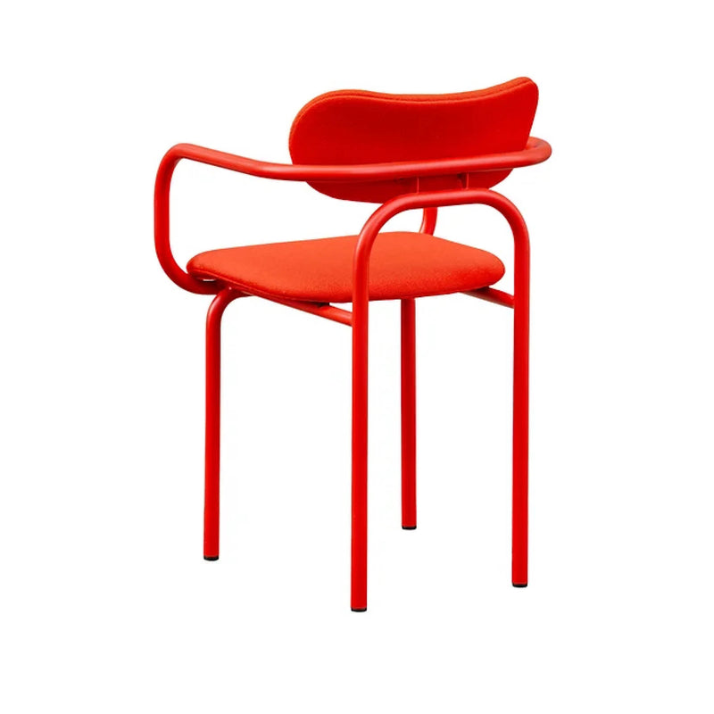 The DOUBLE U arm chair upholstered by Victor Foxtrot features a modern tubular steel design with a bright red frame, wool bouclé upholstery, a padded seat, and a curved backrest—perfect for contemporary interiors that blend sleek design with comfort.