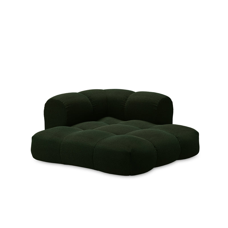 Introducing the Sander Sofa by Objekte unserer Tage: a plush, dark green modular masterpiece with ultrasoft upholstery, featuring a tufted design with a low backrest and deep seats. Its unique, rounded shape embodies postmodernism for a contemporary and inviting look.