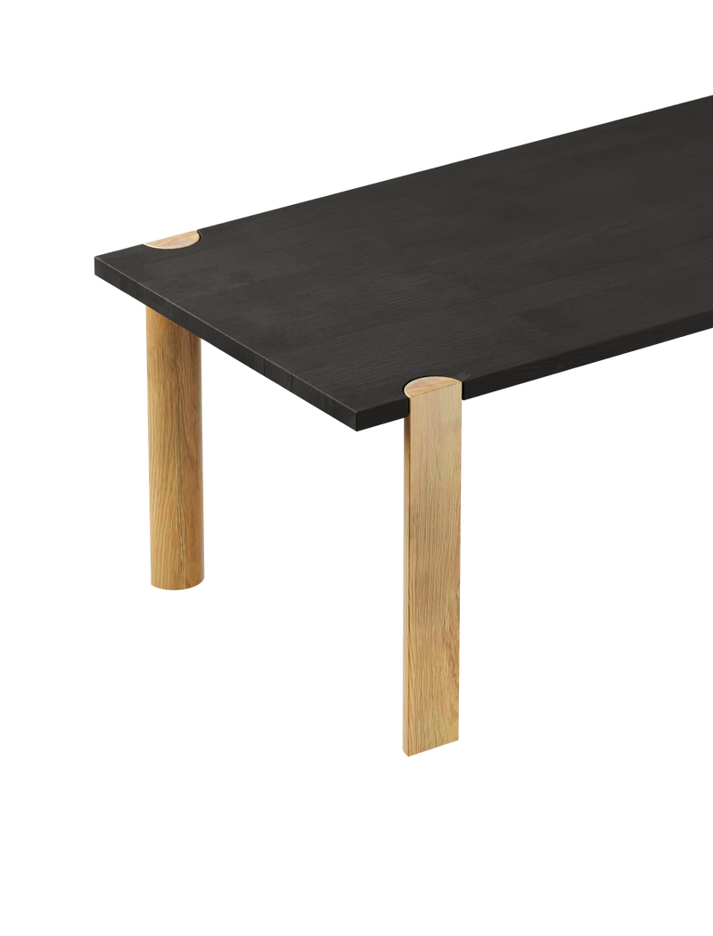 EVERYDAY Table with black walnut top and natural oiled oak half-round legs showcasing endgrain detail.
