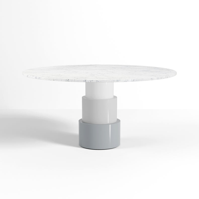U Turn Table Carrara Marble with a three-cylinder base and slim floating Carrara marble top in white shade.