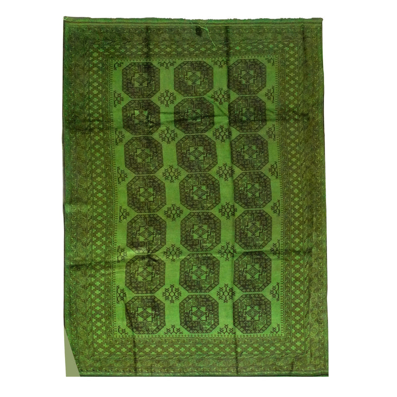 The green Kiskan Color Carpet #1011 - Sale resembles Afghan rugs, featuring a geometric pattern with dark green octagons and intricate borders on a white background.
