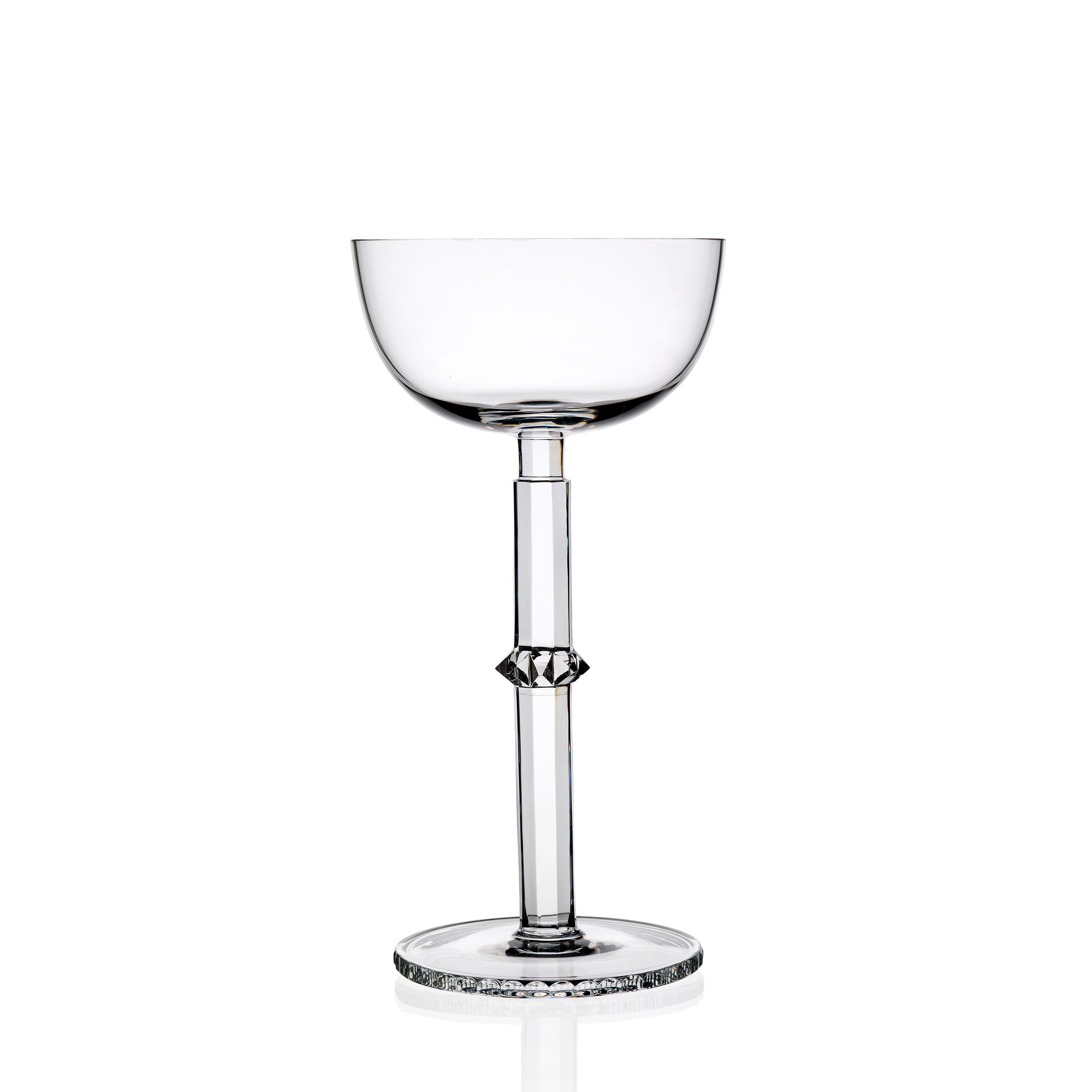 The Hoffmann Goblets by Lobmeyr are clear, elegantly designed champagne glasses made from mouth-blown lead-free crystal. With a tall slender stem and shallow bowl, the base and stem offer subtle decorative details in Josef Hoffmanns style, creating sophistication against a plain white background.