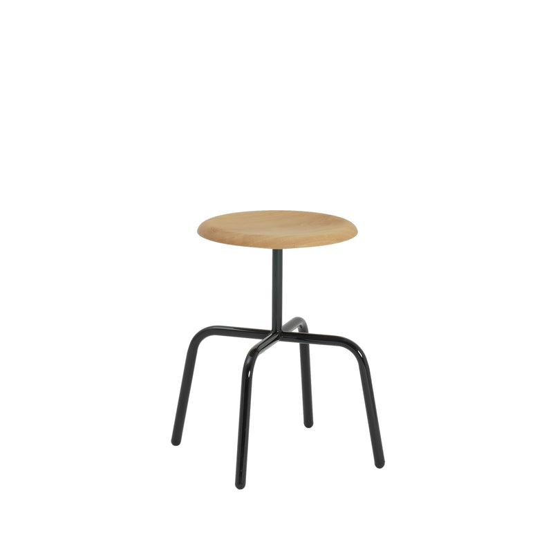The Herrenberger Stool by Atelier Haussmann offers a round wooden seat on a sleek, black tubular steel frame. Its minimalist, industrial design pops against a white backdrop, showcasing slightly bent legs for enhanced stability and modern charm.