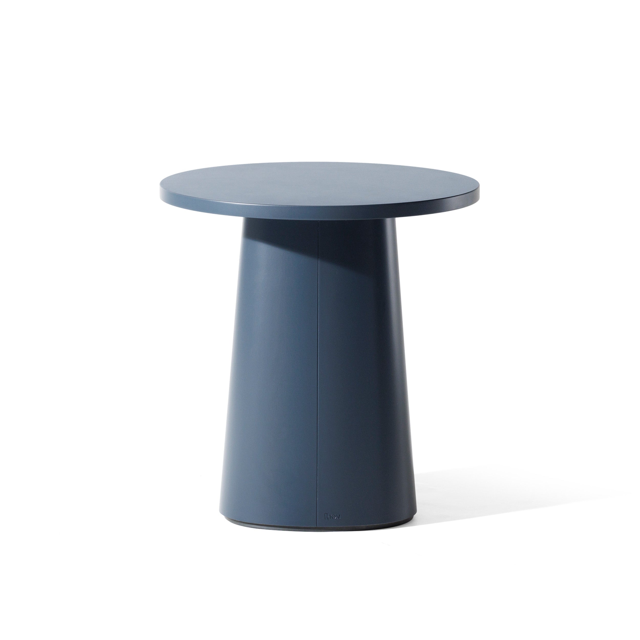 The P.O.V. Coffee Table 473 by TON is a modern piece with a dark blue veneer surface, smooth finish, and conical base. Its design highlights an organic aesthetic and minimalist appeal against a white background.