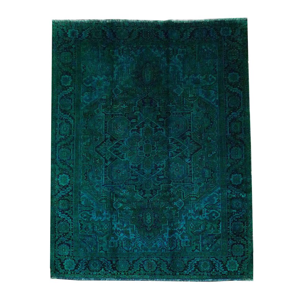 The Color Carpet #522 - Sale by Kiskan is a rectangular blue-green patterned Täbriz rug featuring a central medallion and detailed floral motifs. Handmade from 100% wool, it offers a soft texture, symmetrical pattern, and geometric border.
