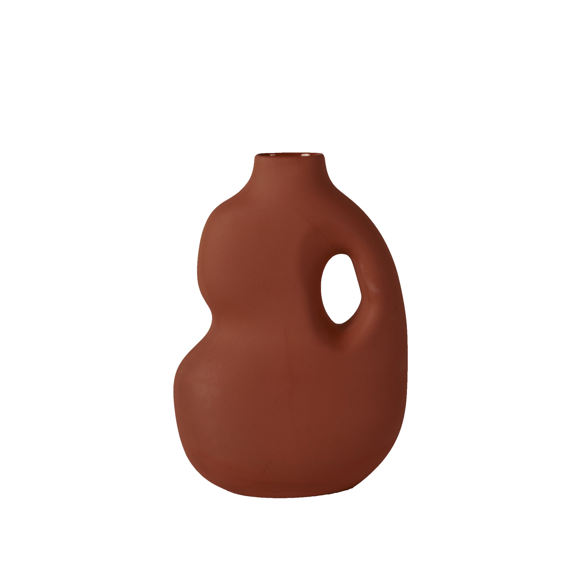 The Aura II vase by Schneid is a modern, abstract piece in terracotta-colored stoneware. It features a rounded, asymmetrical shape with an off-center handle and small top opening, showcasing its unique artistic form beautifully set against a plain white backdrop.