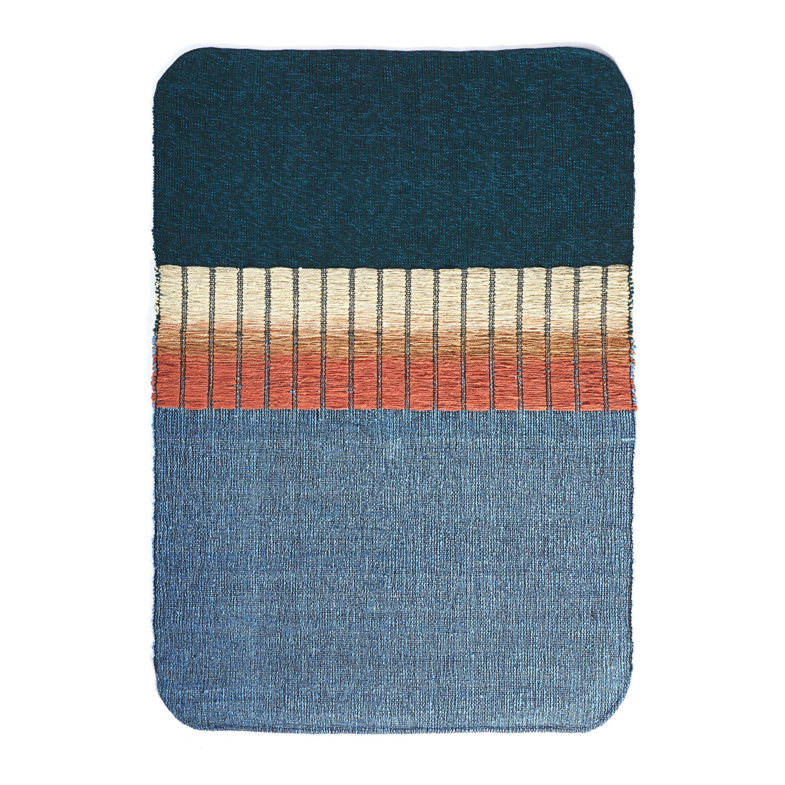 The Ames Balcones Rug is a hand-woven textile art piece with an elegant gradient: dark teal at the top, beige and orange stripes in the center, and light blue at the bottom. The edges are beautifully rounded.