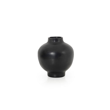 The Ames Barro Vase by Ames is a round, matte black ceramic vase inspired by handmade Colombian ceramics, featuring a small top opening and shown against a plain white background.