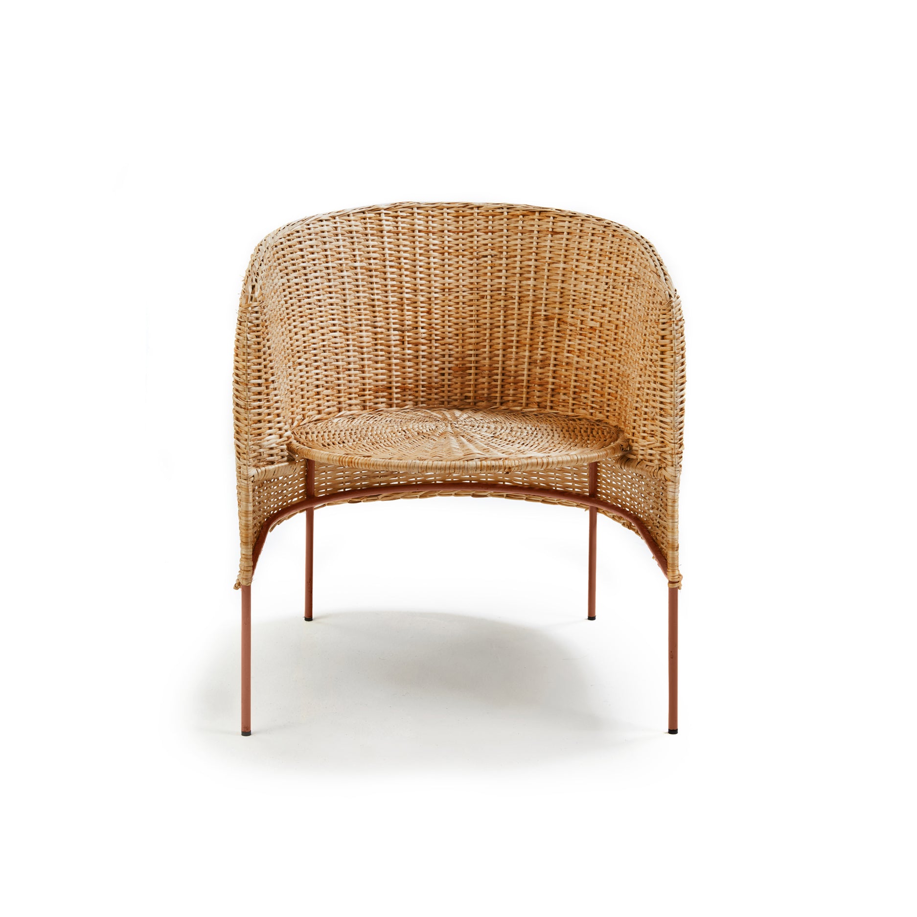 The Ames Caribe Natural Lounge Chair by Ames features a rounded woven rattan backrest and seat, slim metal legs, and is inspired by Sebastian Herkner’s Caribe chairs, photographed against a plain white background.