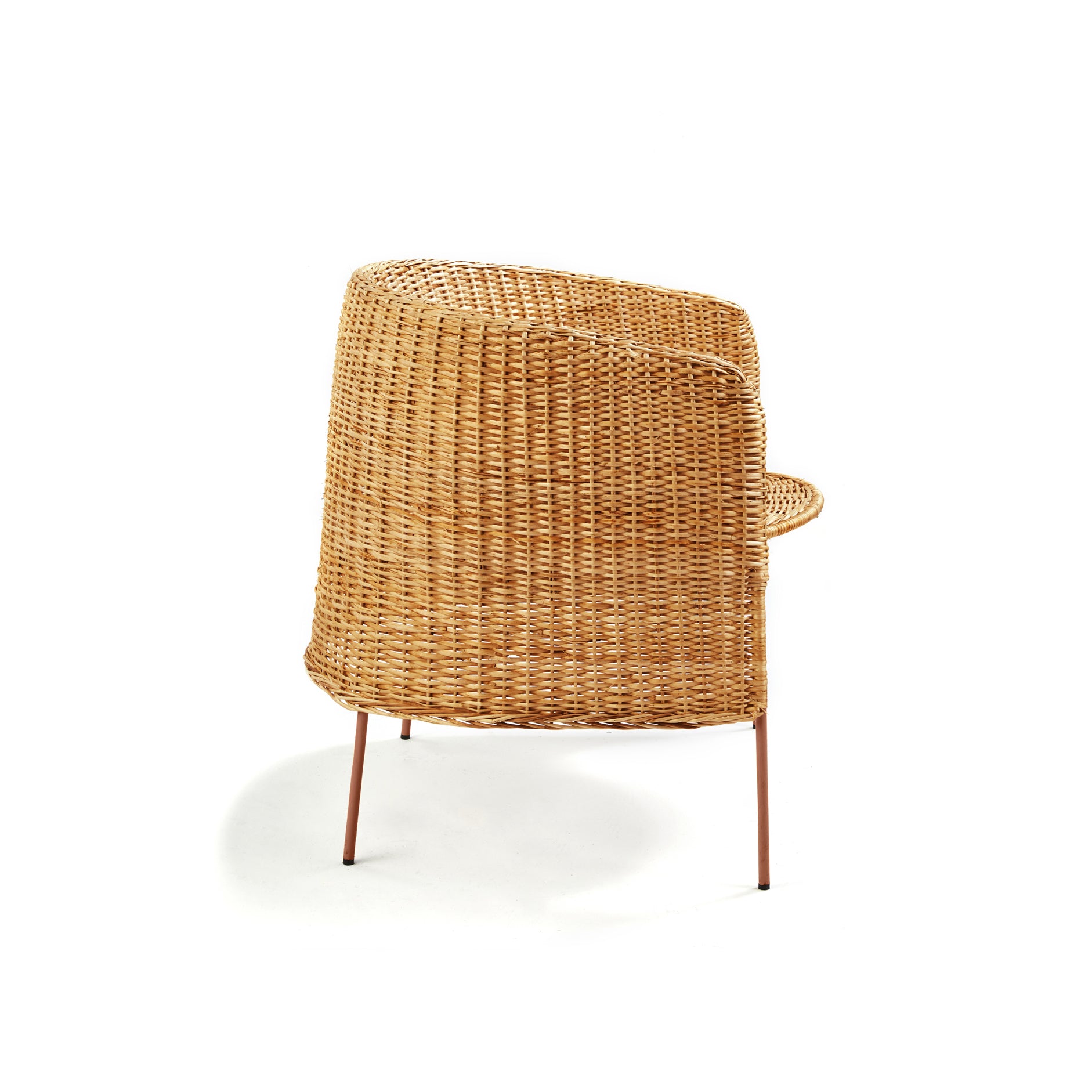 The Ames Caribe Natural Lounge Chair by Ames features a woven rattan design inspired by Caribe chairs, with a rounded back and metal legs, shown from behind against a white background.