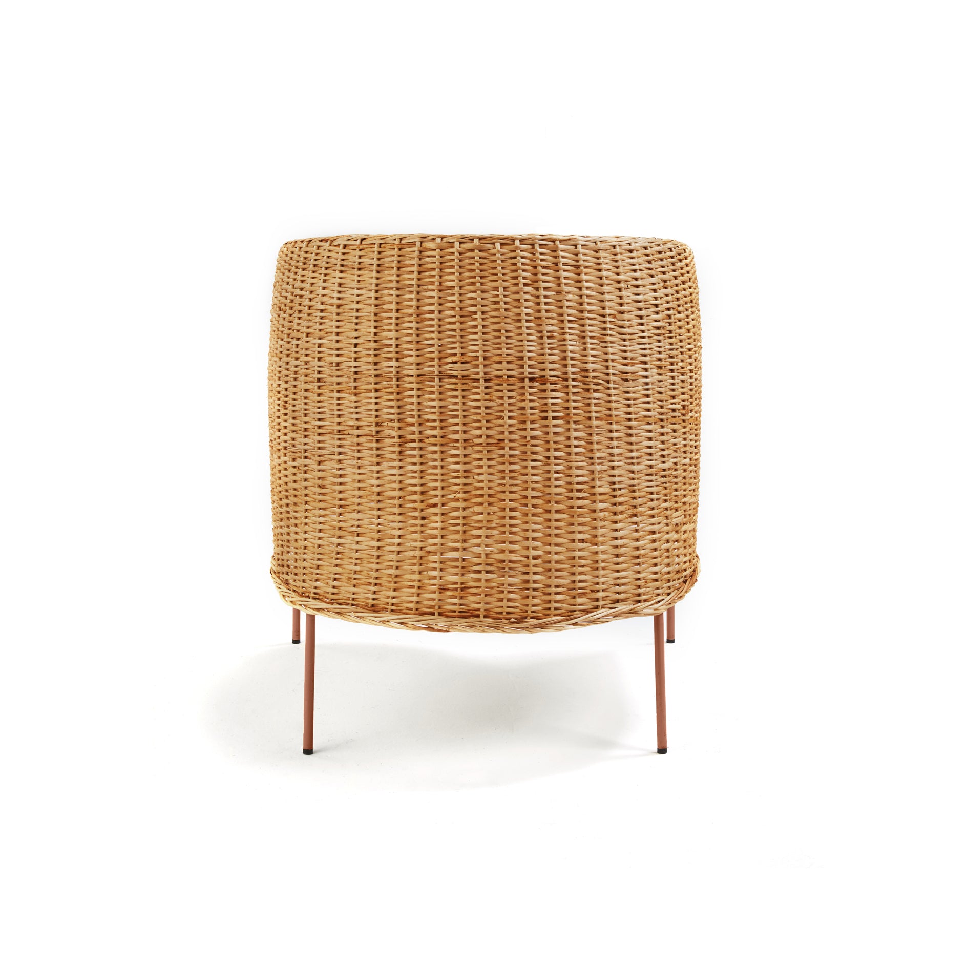 The Ames Caribe Natural Lounge Chair by Ames features a rounded backrest and slim, angled metal legs, offering a modern twist on natural wicker design—seen from behind against a plain white background and inspired by Caribbean style.