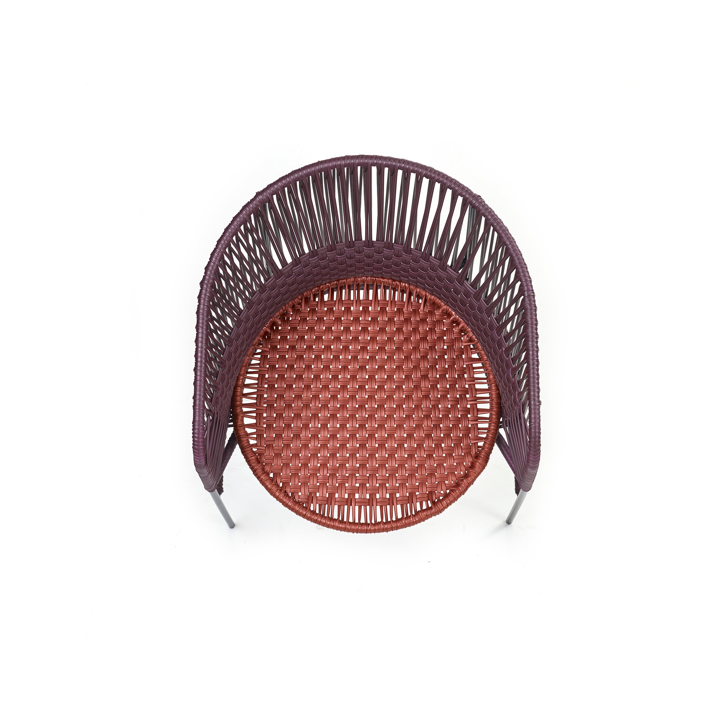 Top view of the Ames Caribe Chic Dining Chair by Sebastian Herkner, showcasing a complex woven pattern. The reddish-brown seat made from recycled plastic cord contrasts with a darker backrest, casting a subtle shadow on a white background.