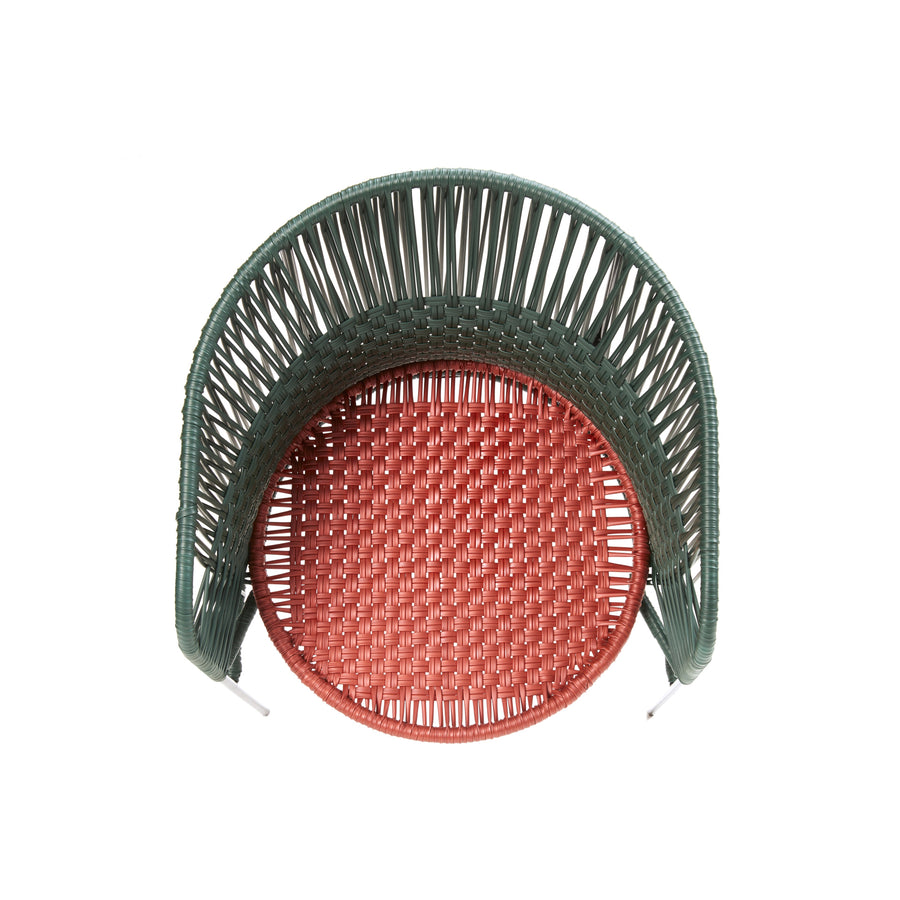 Experience the artistic allure of Ames Caribe Chic Dining Chair by Sebastian Herkner. The woven design from recycled plastic cord features a red circular seat and a green curved backrest, offering a strikingly modern look from the top view.