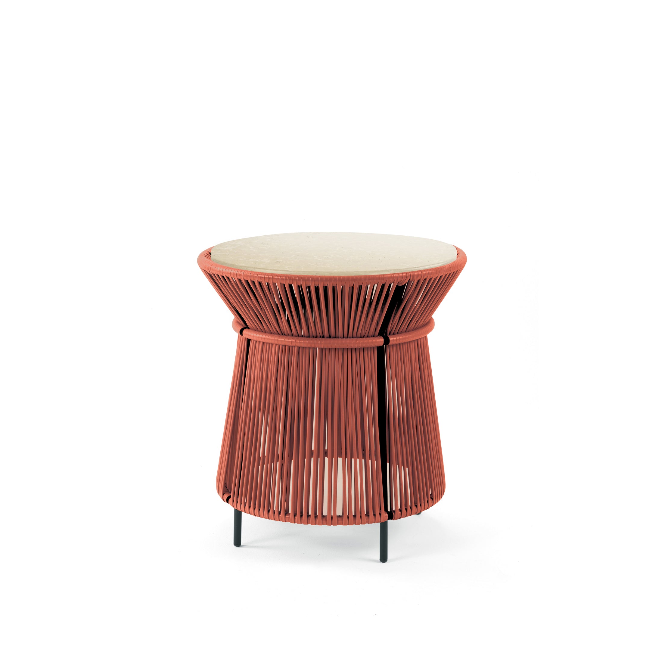 The Ames Caribe Chic High Table by Sebastian Herkner features a beige top, a red woven basket-like base, and three slender black legs. This modern, round table embodies Colombian craftsmanship and suits both indoor and outdoor spaces.