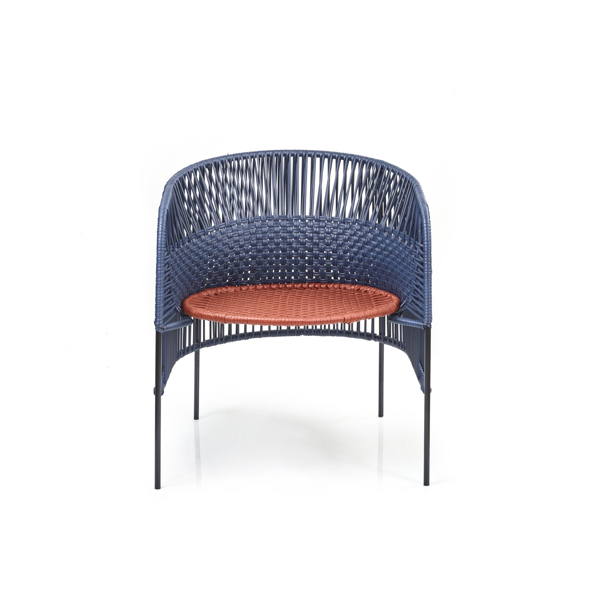 The Ames Caribe Chic Lounge Chair by Ames, designed by Sebastian Herkner, showcases a blue woven backrest and sides with Colombian craftsmanship, thin black legs, and a circular orange woven seat, all set against a white background.