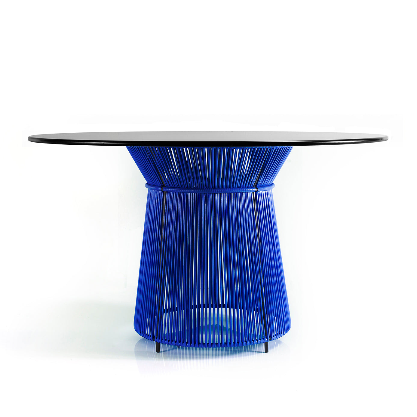 The Ames Caribe Dining Table features a modern circular design with a black top and an eye-catching base of blue vertical metal rods, reminiscent of momposino weaving for a net-like effect—perfect for outdoor settings against a plain white background.