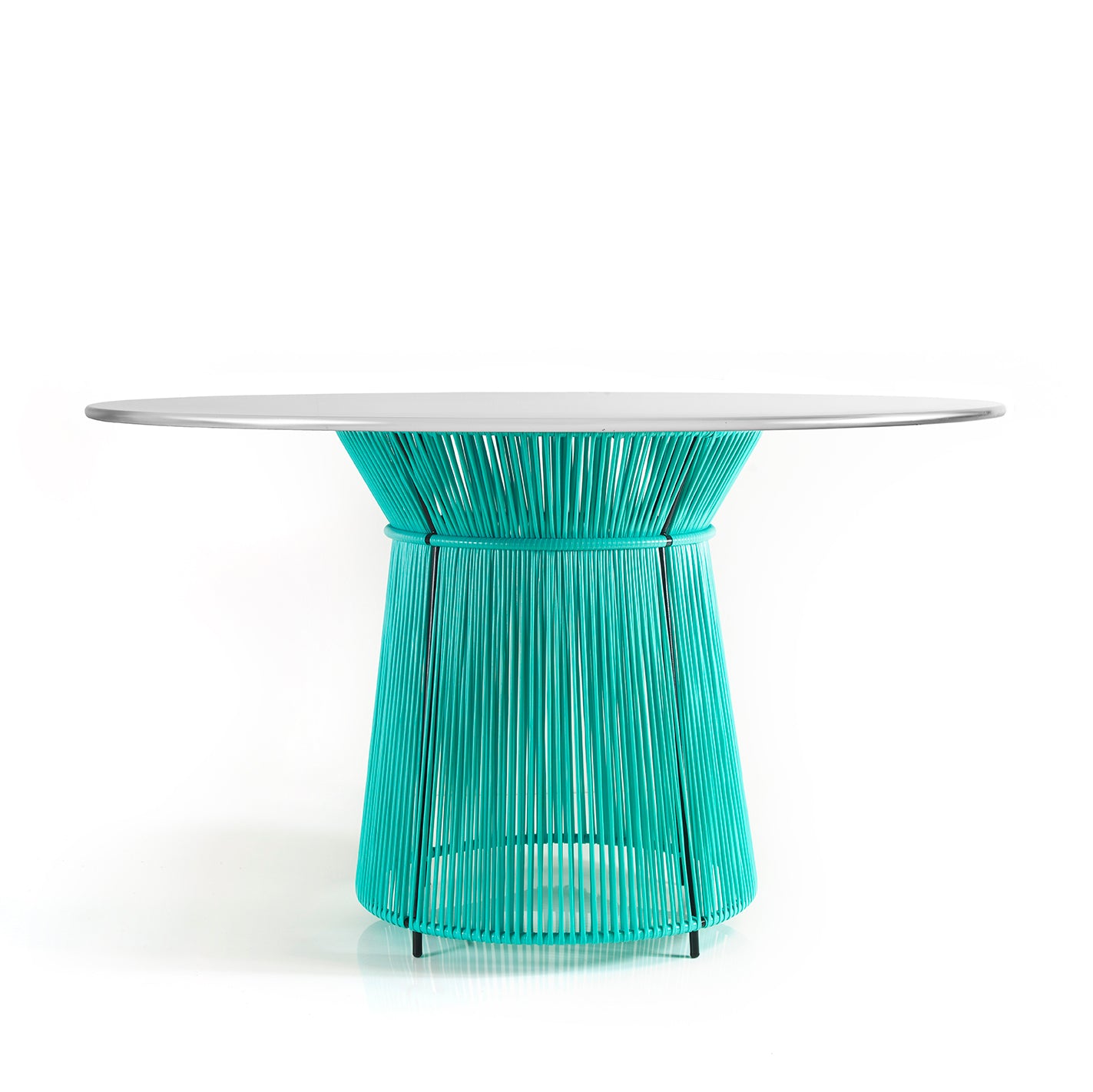 The Caribe Dining Table by Ames features a sleek white top and a vibrant turquoise base made of artistic vertical rods. Its part of our outdoor furniture collection and adds Caribbean flair against a plain white backdrop.